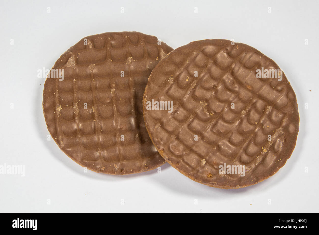 Milk Chocolate digestive biscuits isolated on a white background Stock
