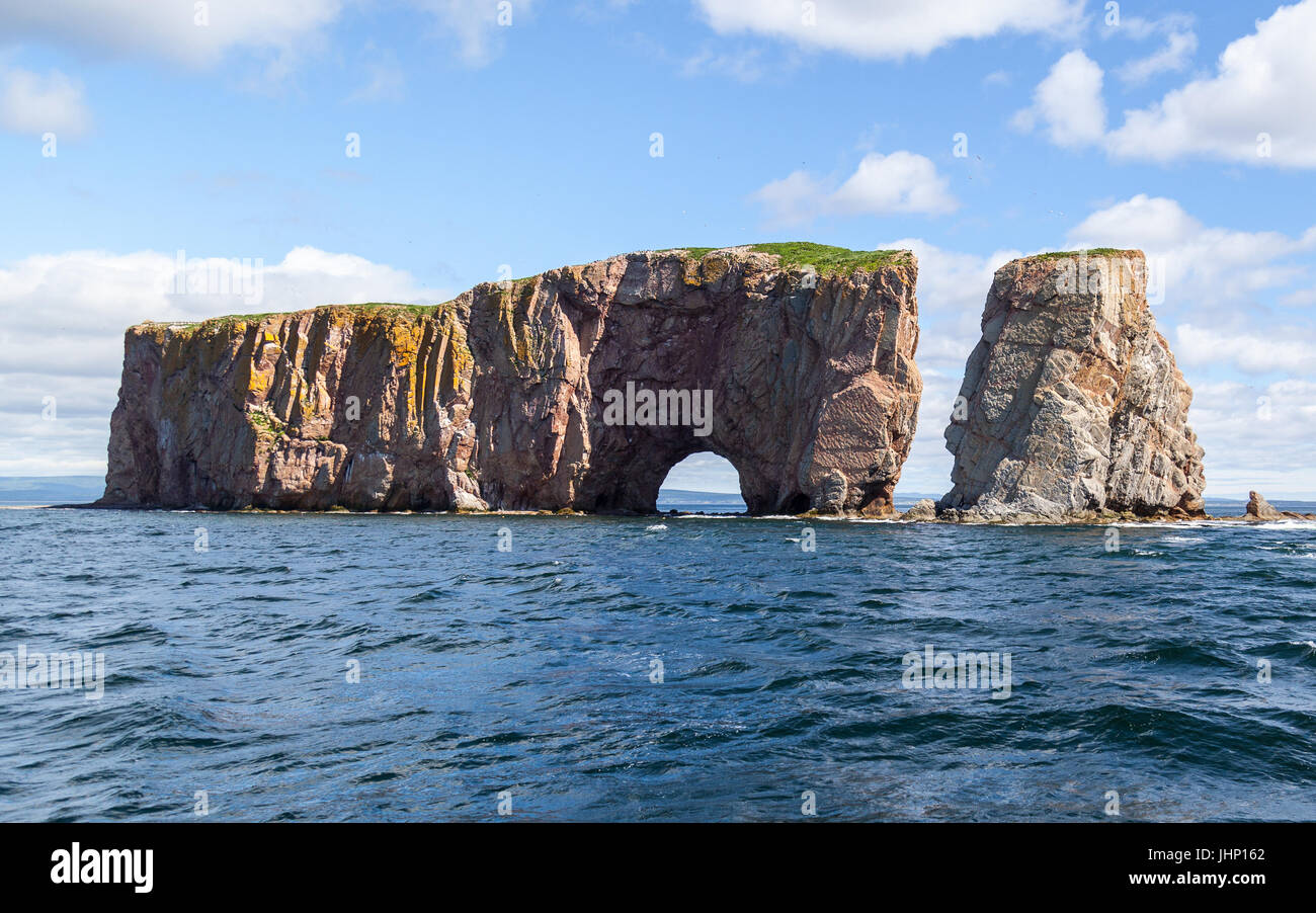 Perce Rock, Perce, Gaspe, Peninsula, Quebec, Canada Perce Rock is one of the world's largest natural arches located in water. Stock Photo