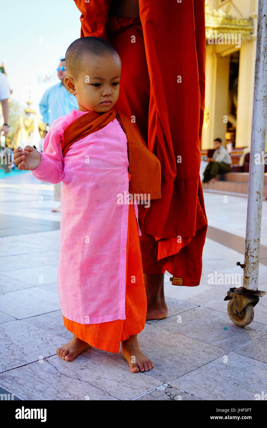 Yangon, Myanmar Oct 16, 2015. A little Buddhist nun on street in