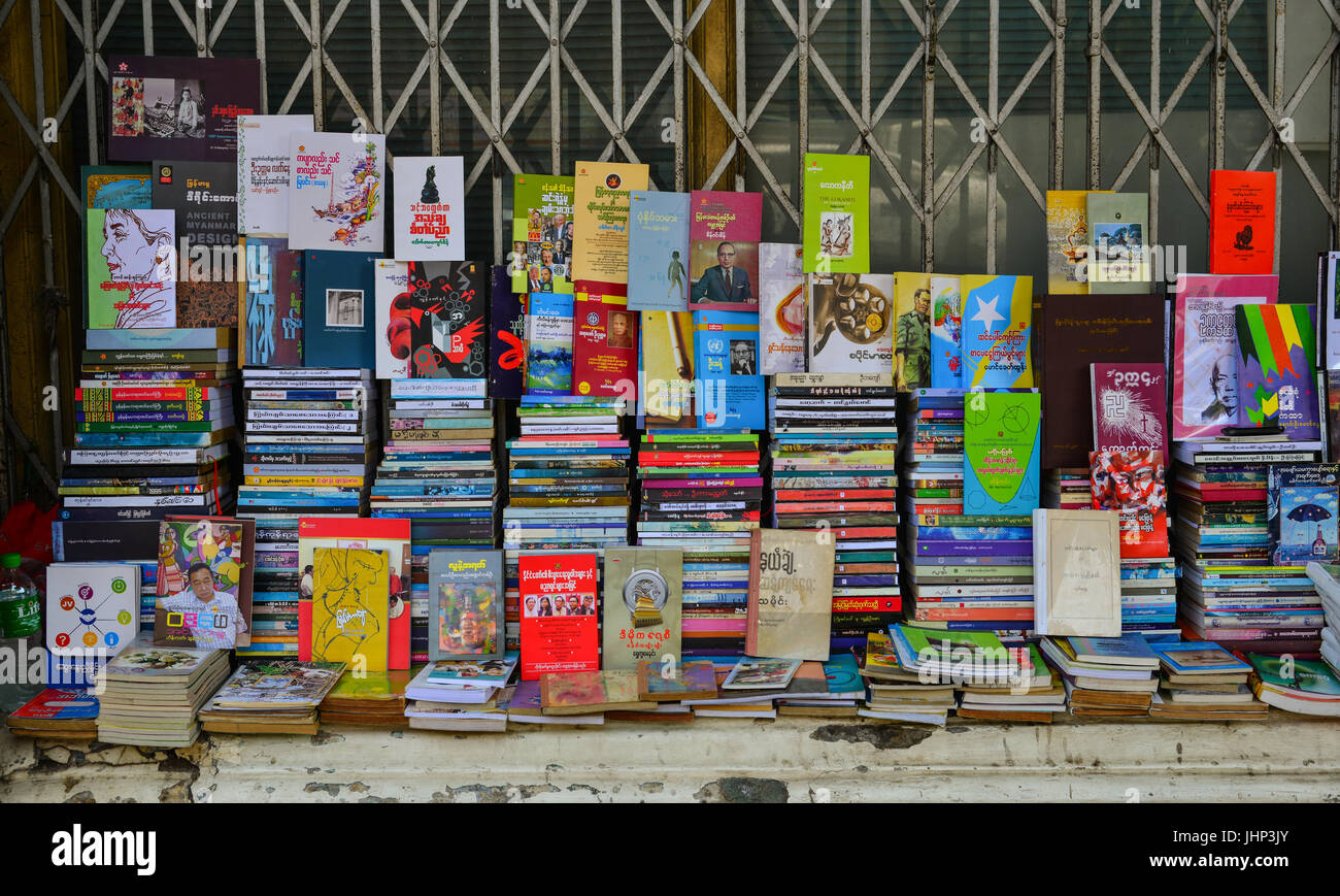 Yangon, Myanmar - Feb 13, 2017. Selling books at downtown in Yangon, Myanmar. Yangon is a city that balances tradition, culture and modernity. Stock Photo
