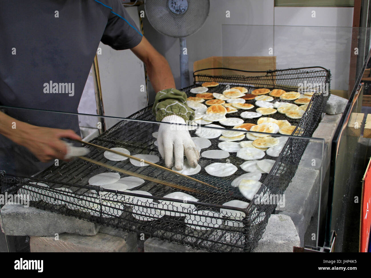 Man making rice crackers in Tokyo Stock Photo