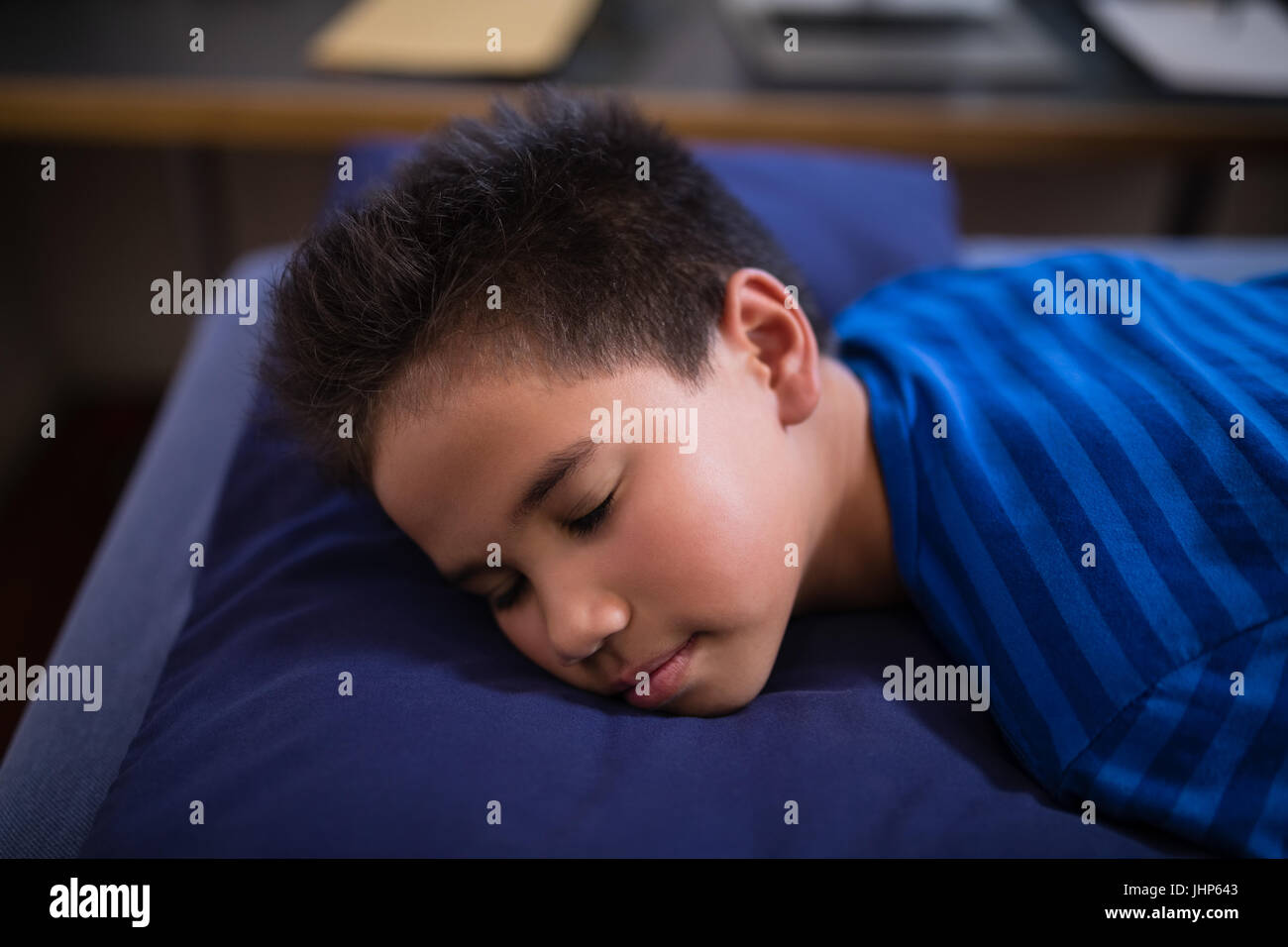 High angle view of boy sleeping on bed at hospital ward Stock Photo
