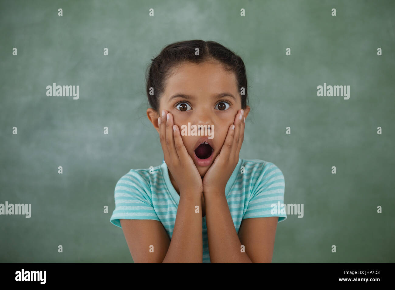 Portrait of surprised young girl Stock Photo - Alamy