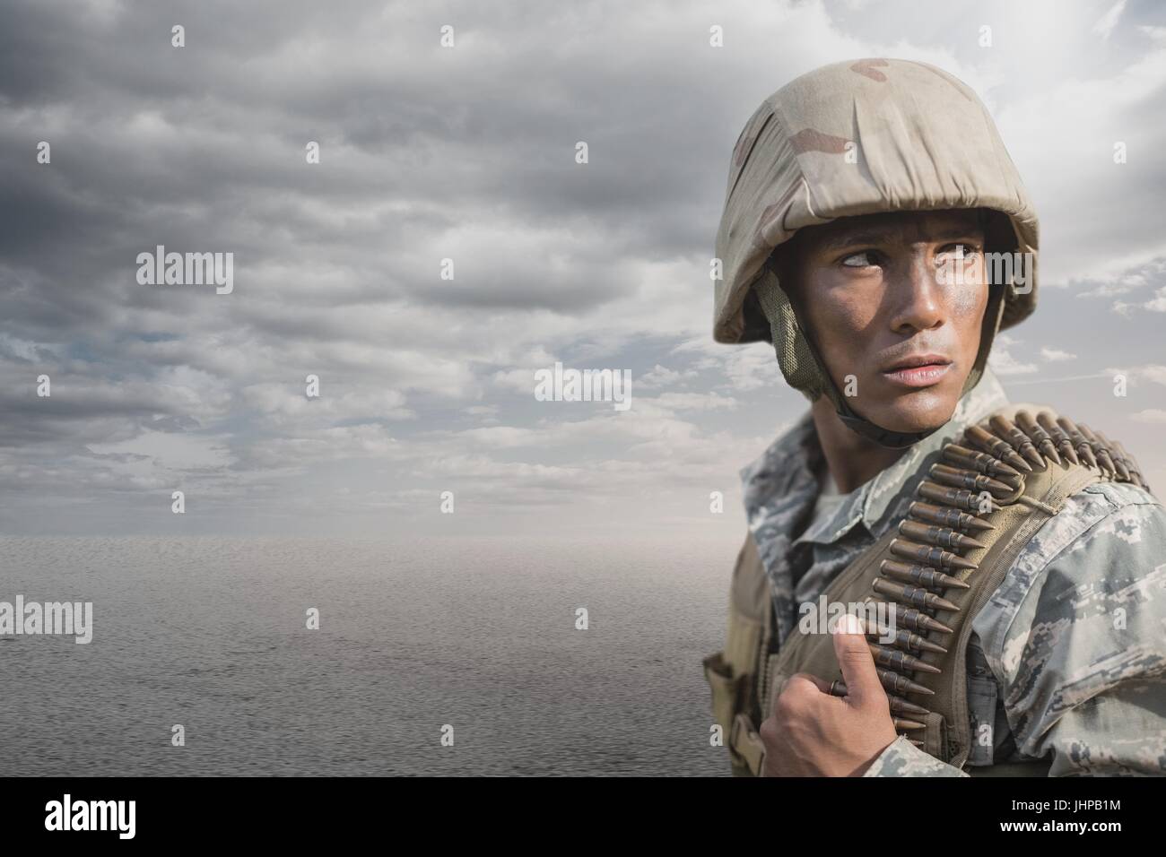Digital composite of Soldier man standing against desert background Stock Photo