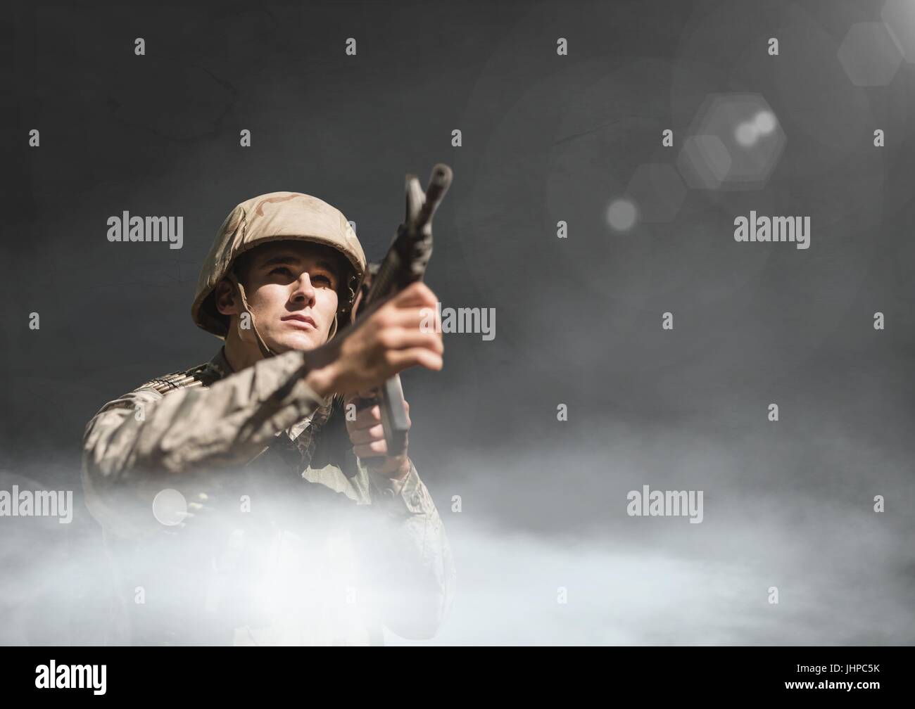 Digital composite of Soldier man holding a weapon against black ...