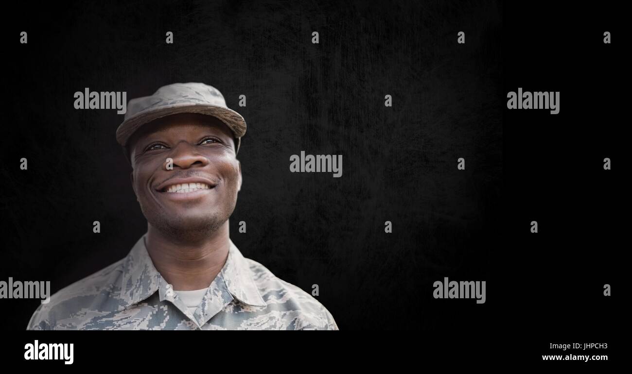 Digital composite of Happy soldier man standing against black ...