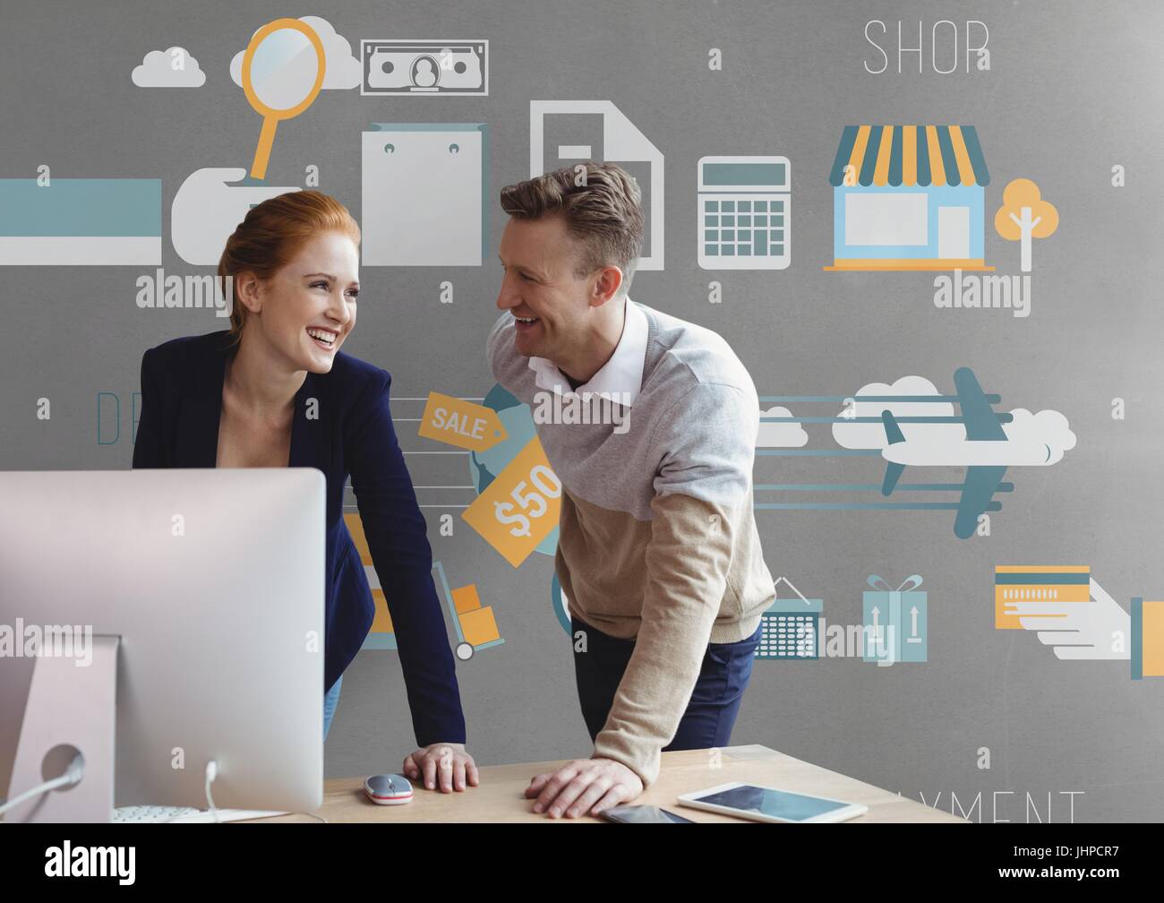 Digital composite of Happy business people at a desk using a computer ...