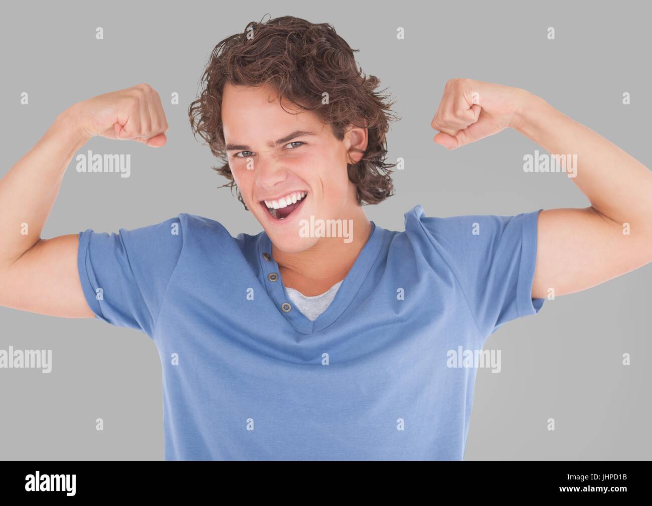 Digital composite of Portrait of Man flexing arm muscles with grey