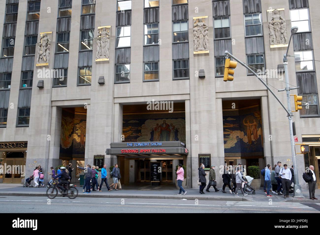 entrance to 30 rockefeller plaza comcast building with neon sign for the tonight show with jimmy fallon New York City USA Stock Photo