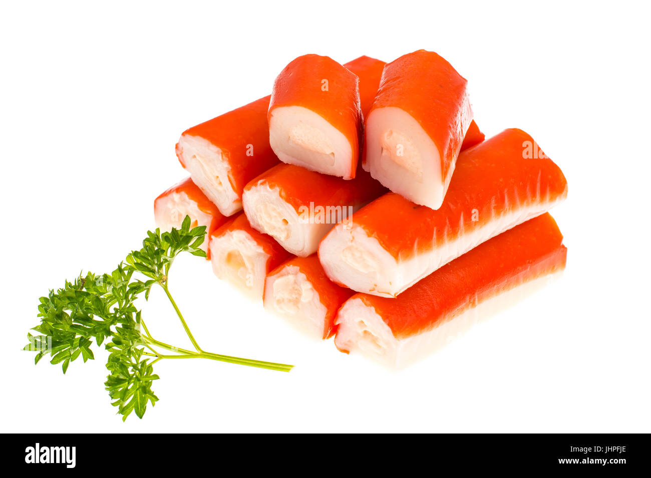 Crab sticks surimi stuffed with cheese on white background. Studio