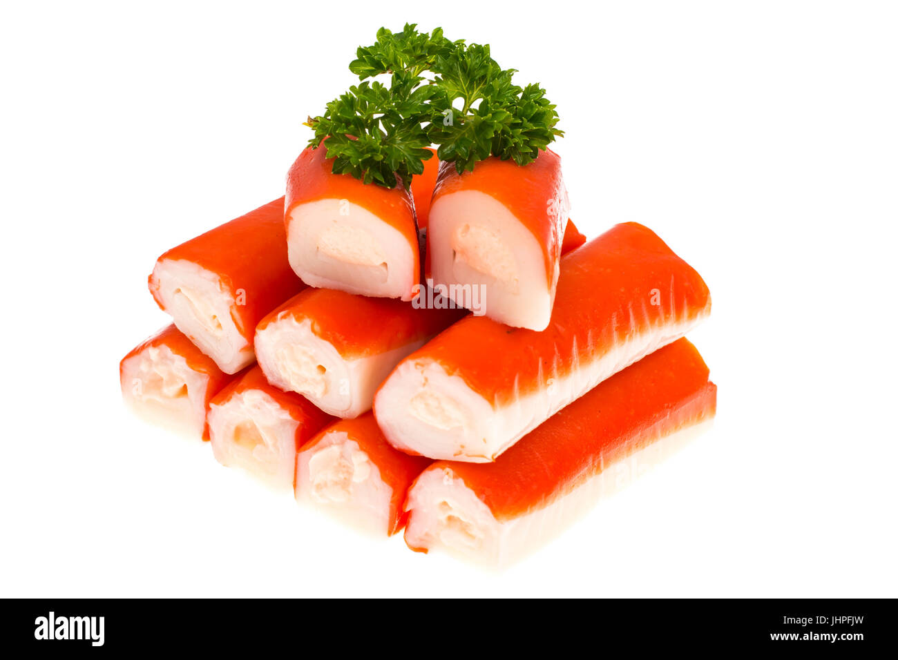 Crab sticks surimi stuffed with cheese on white background. Studio