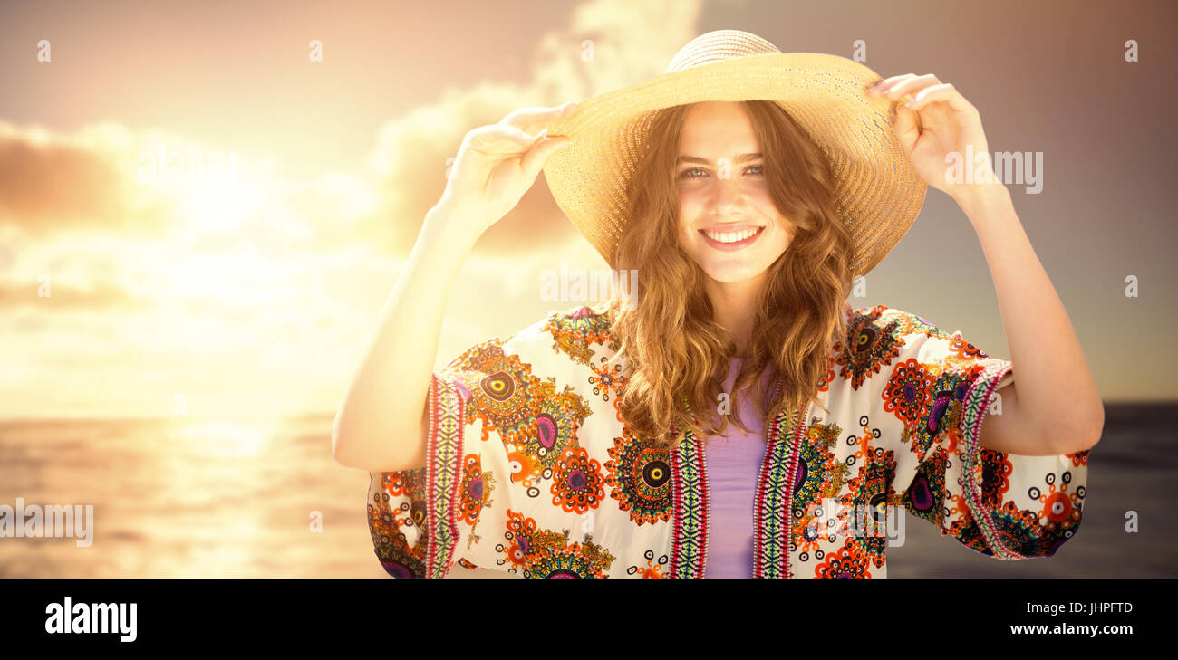 Beautiful woman with a straw hat against view of beautiful sea Stock ...