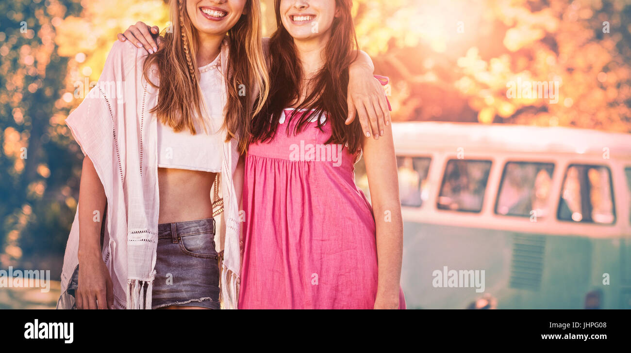 Happy friends standing together in park Stock Photo - Alamy