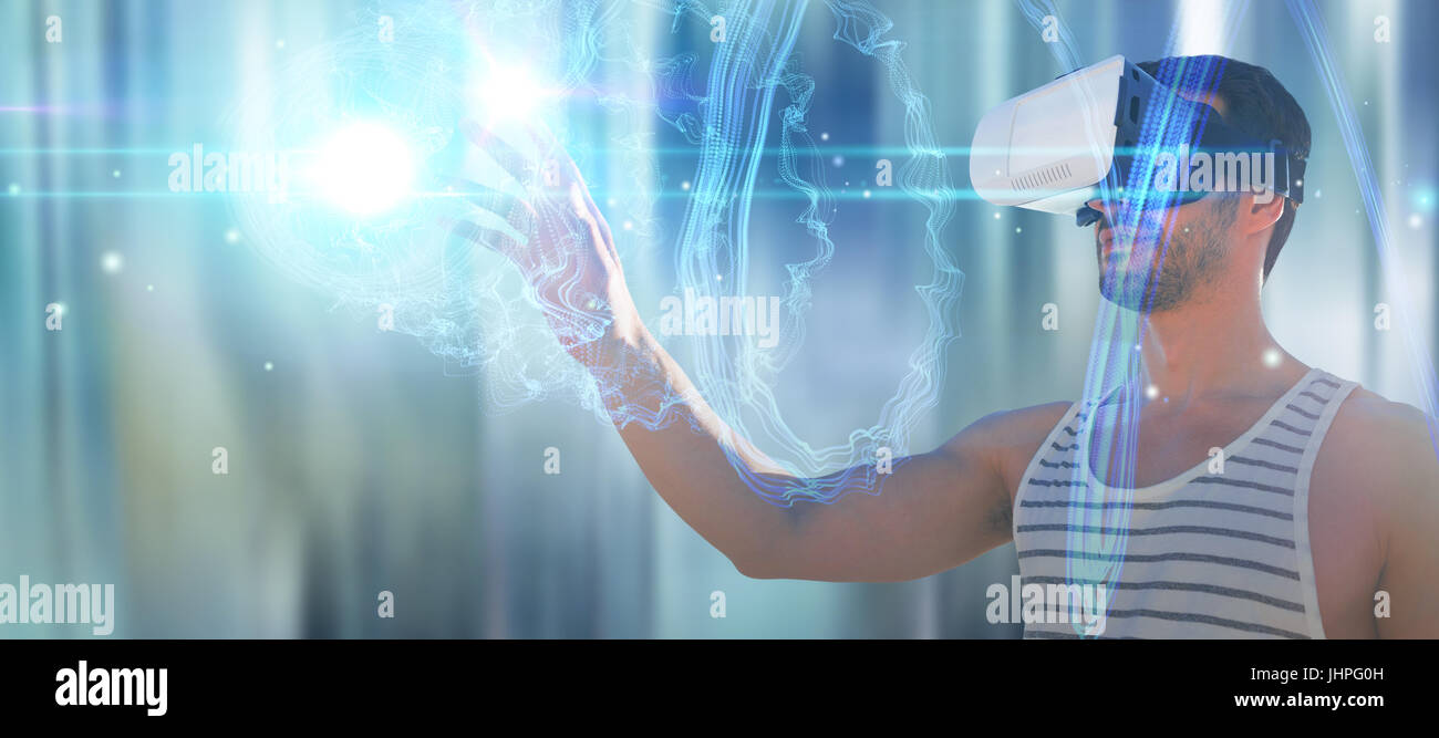 Young man using virtual reality glasses against futuristic shiny spiral ...
