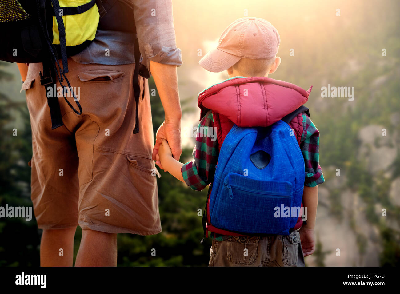 Father and son hiking together Stock Photo