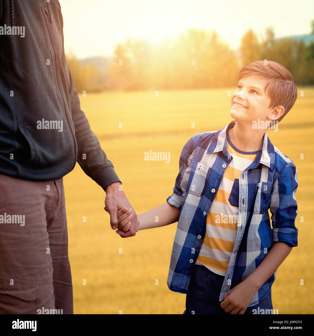 Father and son hiking together Stock Photo