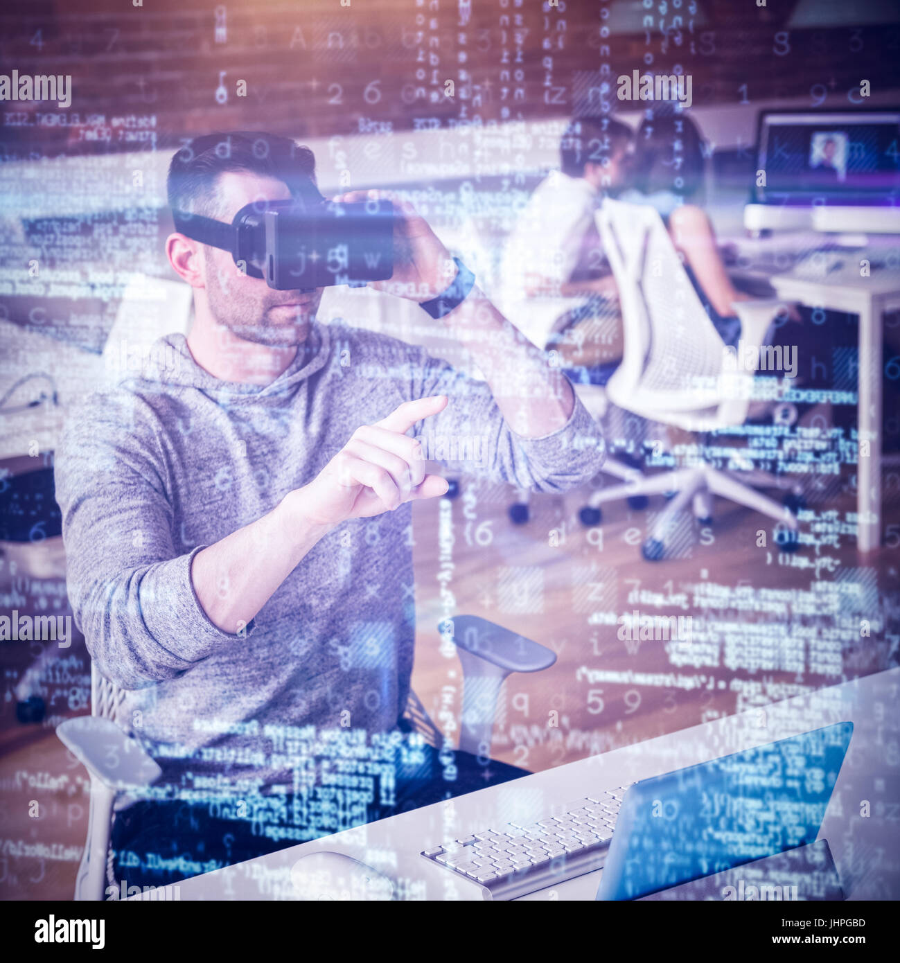 Male executive using virtual reality headset in office Stock Photo - Alamy