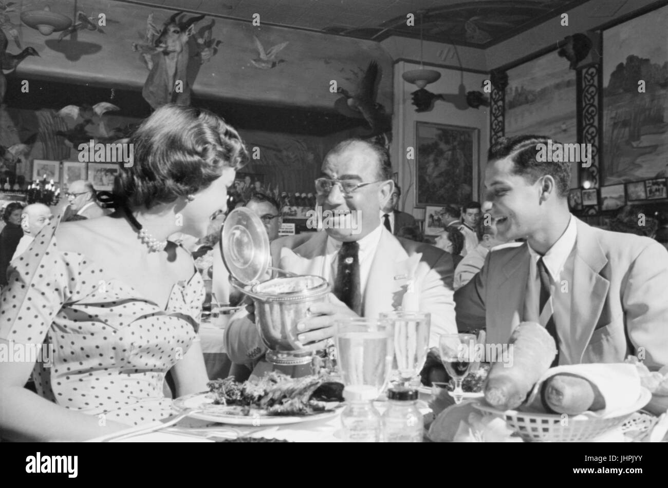 Diamond Jim Moran, entertaining guests at his restaurant in New Orleans, 1953 Stock Photo