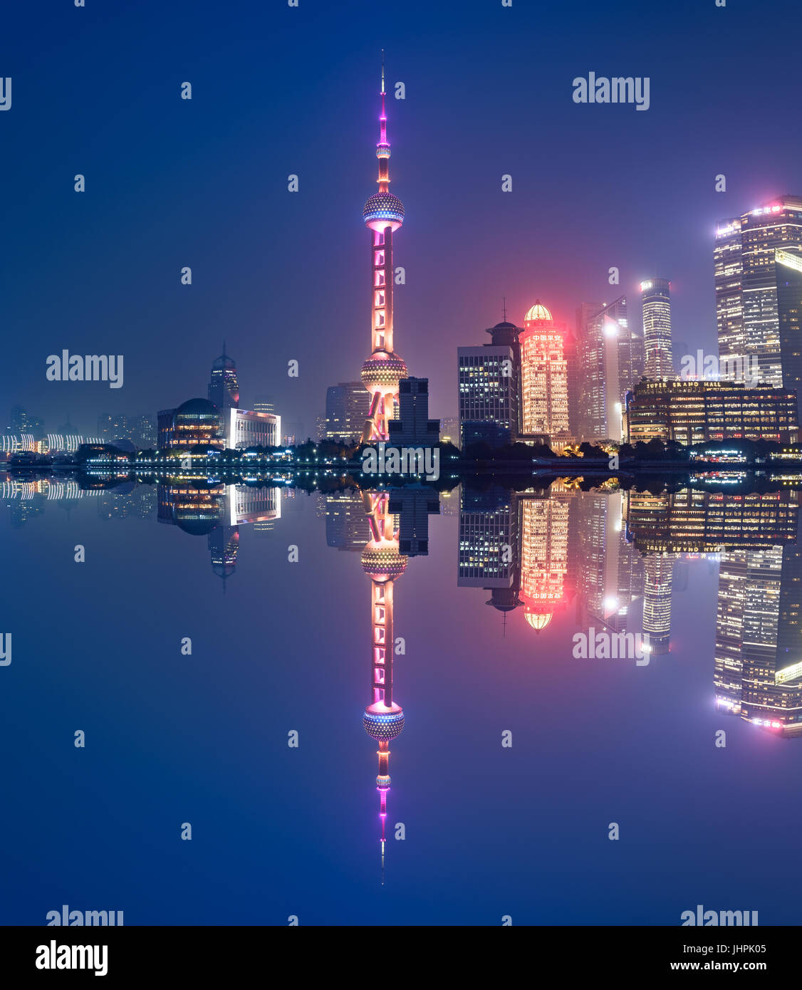 Aerial panoramic view over a big modern city by night. Shanghai, China. Nighttime skyline with illuminated skyscrapers Stock Photo