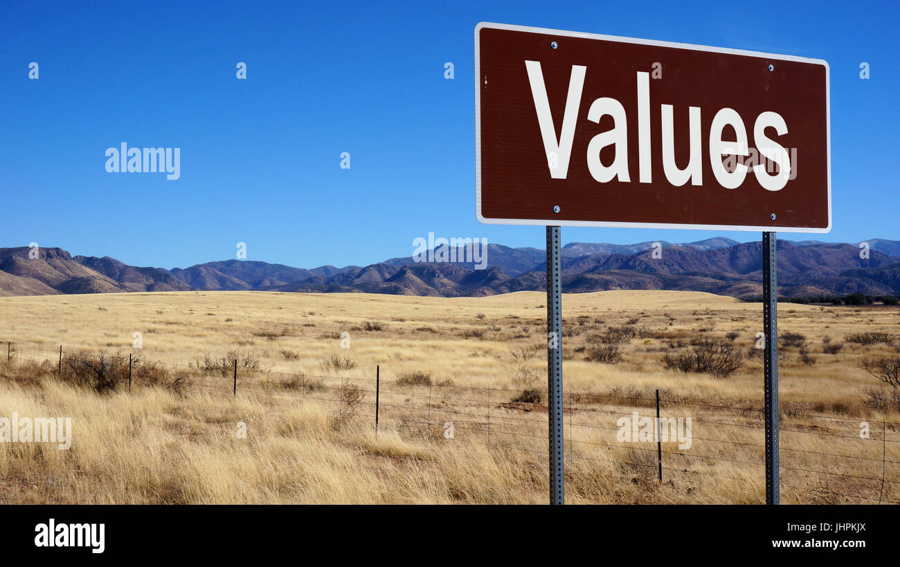 Values road sign with blue sky and wilderness Stock Photo - Alamy