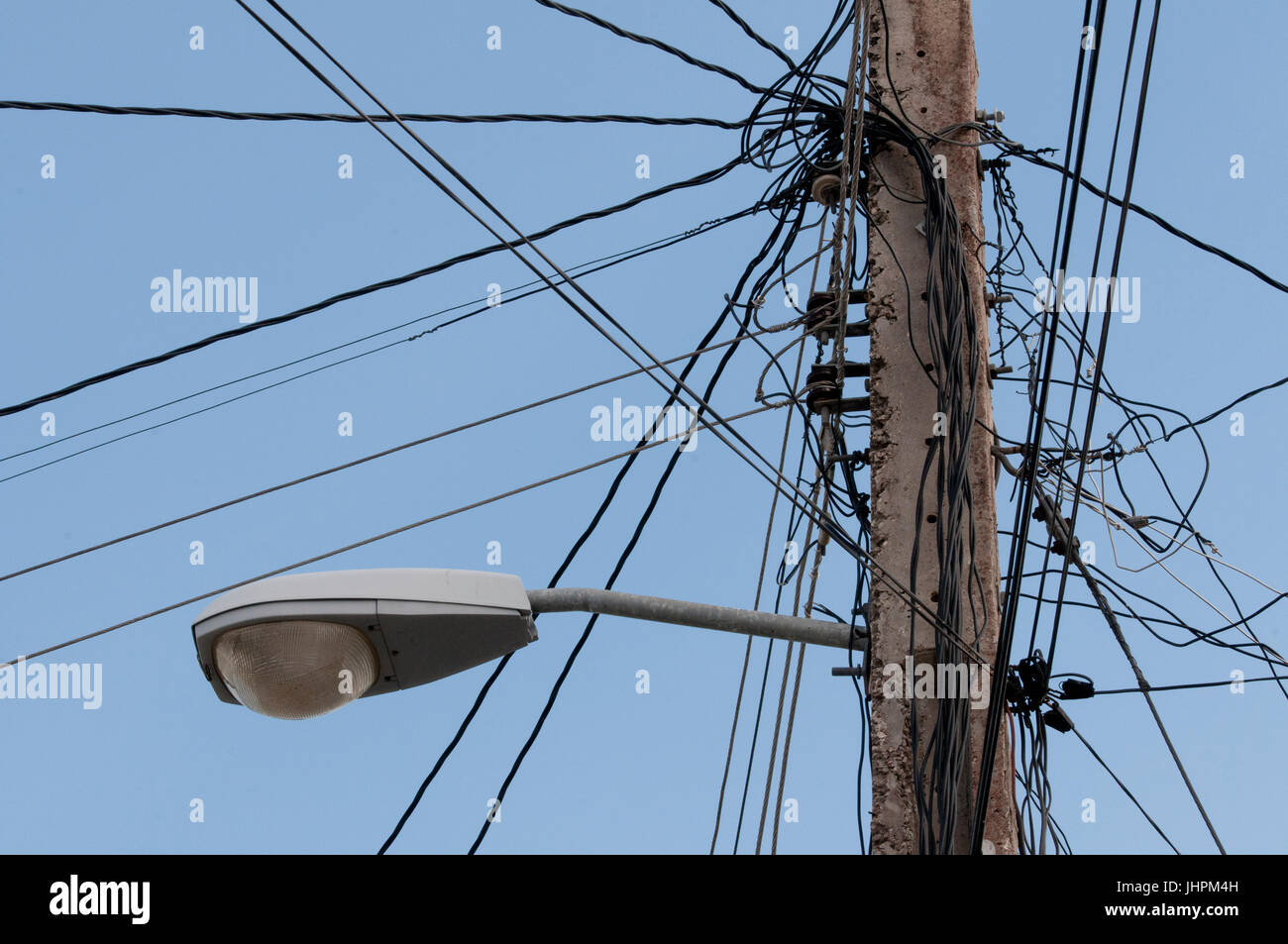 Electrical wiring on power pole in Cuba Stock Photo