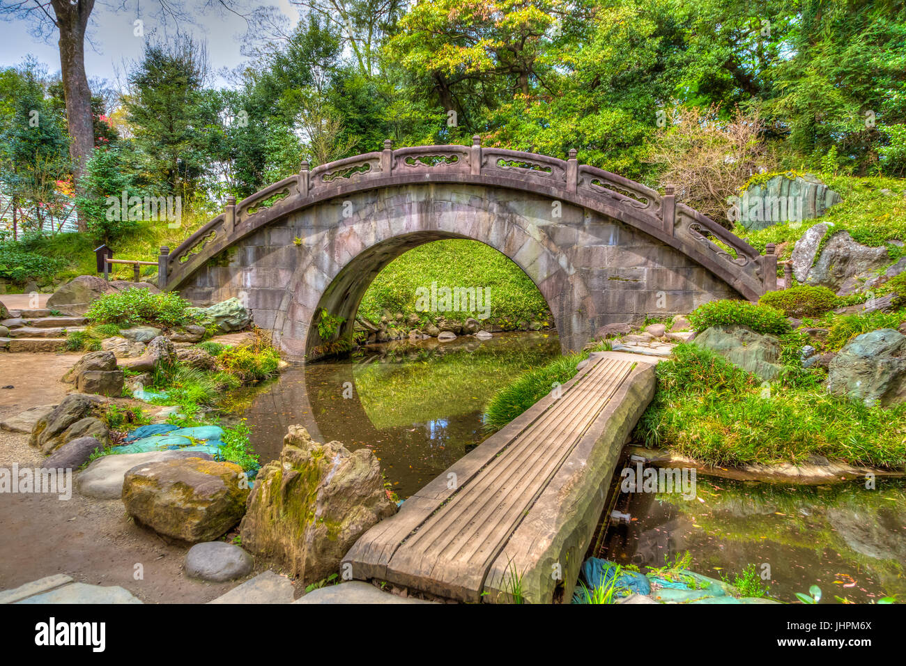 A stone arched bridge in the Koishikawa Kōrakuen Gardens in Bunkyo ...