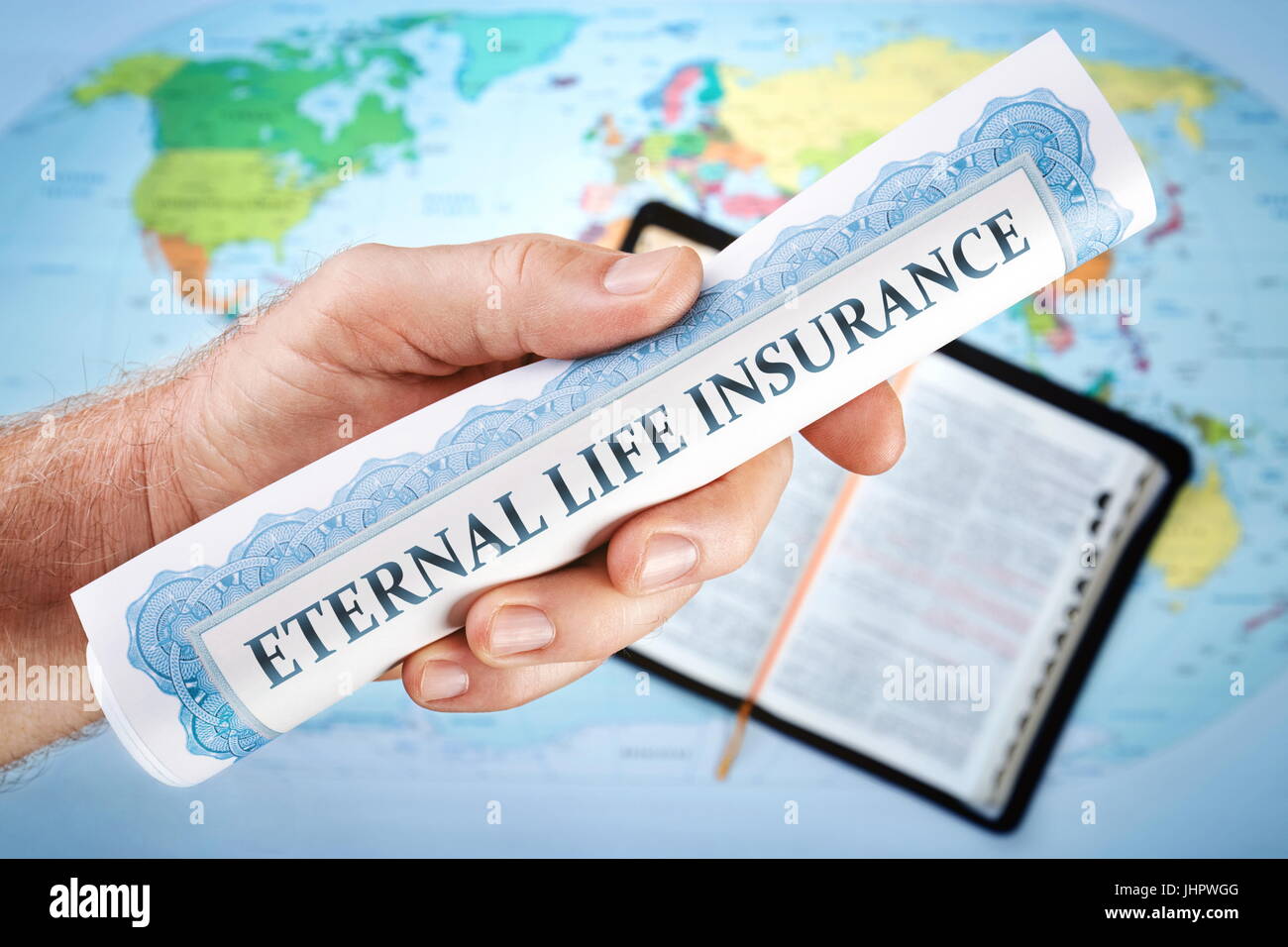 Concept of God's eternal life insurance 'certificate' from the Bible. The world offers all kinds of insurances bur not Eternal life insurance. Stock Photo