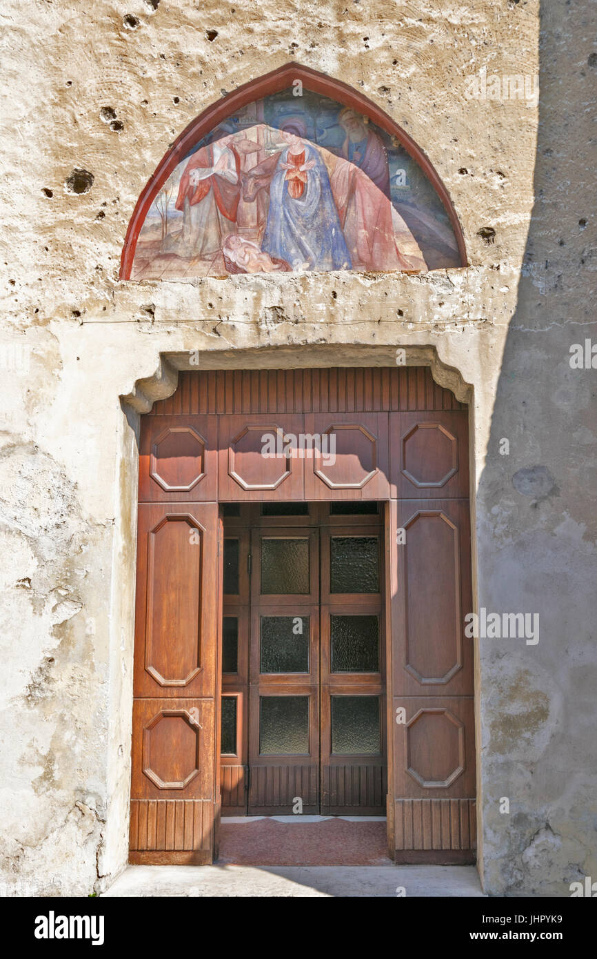 LAKE GARDA SIRMIONE CHURCH DOOR AND MURAL CIRCA 1514 Stock Photo