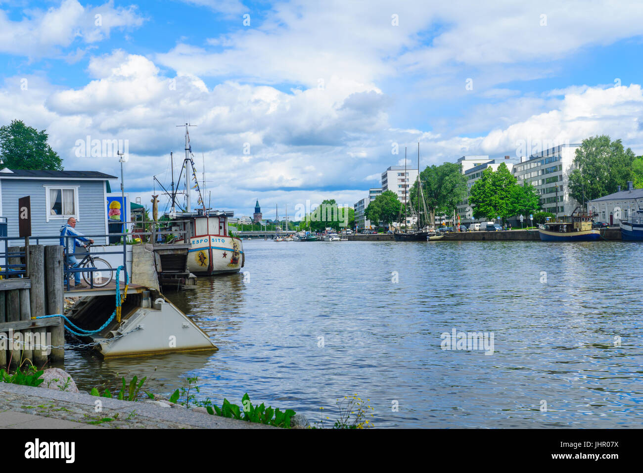 TURKU, FINLAND - JUNE 23, 2017: Scene of the Aura river, with a man waiting for the Fori ferry, in Turku, Finland Stock Photo
