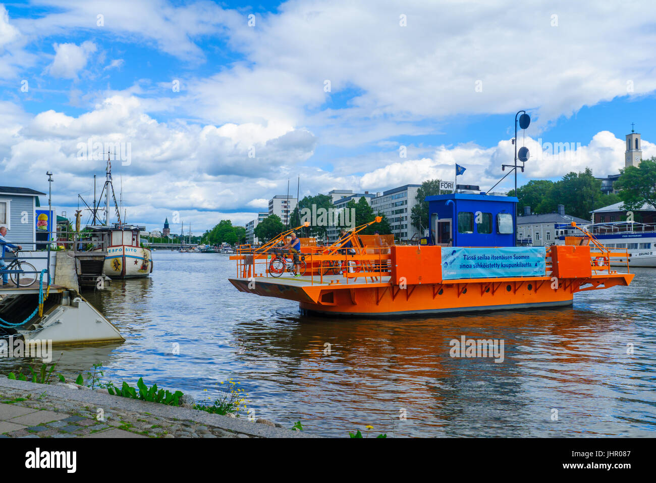 TURKU, FINLAND - JUNE 23, 2017: Scene of the Aura river, with the Fori ferry and passengers, in Turku, Finland Stock Photo