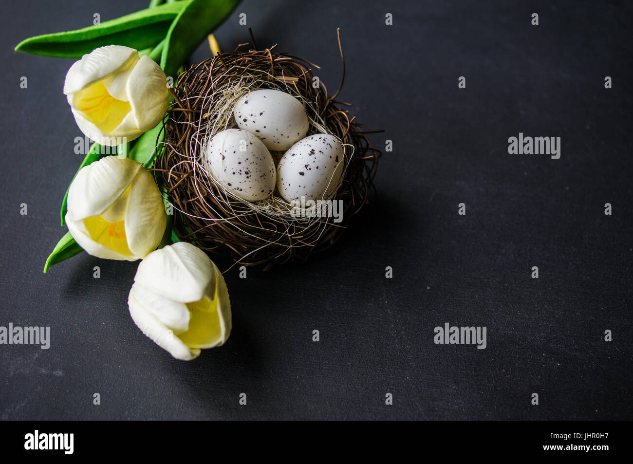 Easter frame with tulips and easter eggs on dark background Stock Photo ...