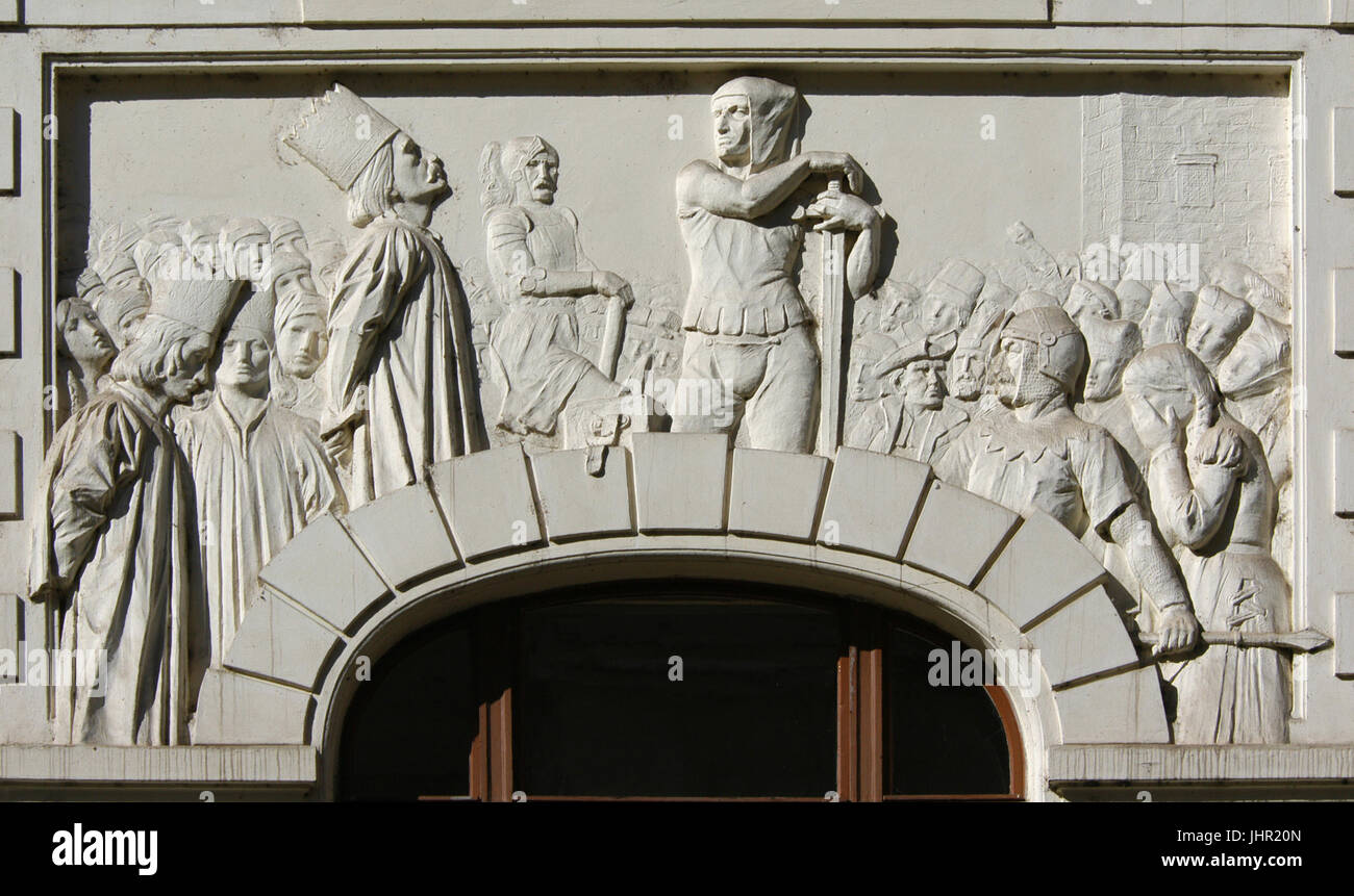 Execution of Christian heretics in the Middle Ages depicted in the Art Nouveau stucco relief by Czech sculptors Eduard Piccardt and František Kraumann on the House at the Three Swords (Dům u tří mečů) in Platnéřská Street in Staré Město (Old Town) in Prague, Czech Republic. The building designed by Czech architect Emanuel Dvořák was built in 1902. Stock Photo