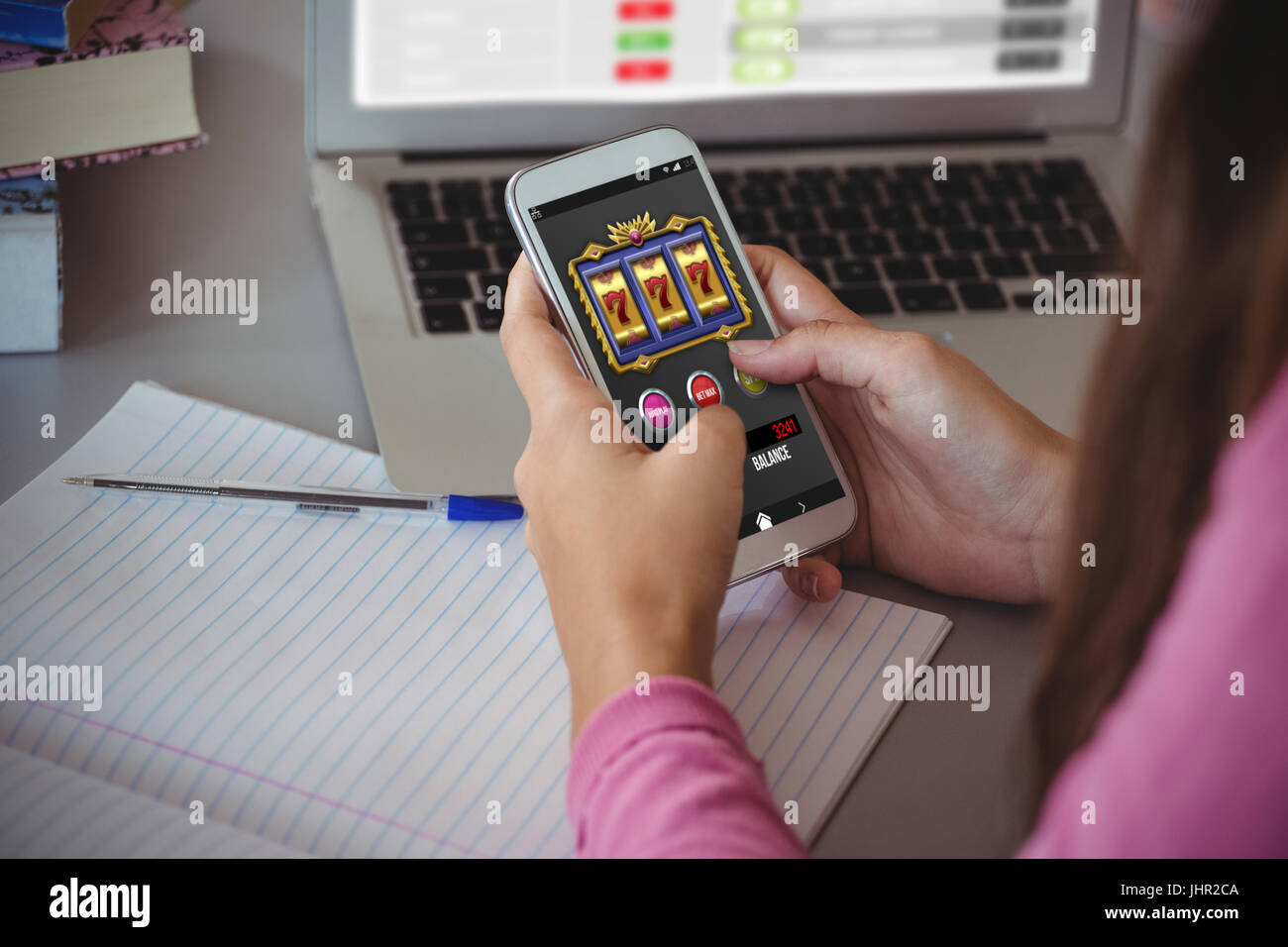 Casino Slot Machine App On Mobile Screen Against Schoolgirl Using Stock Photo Alamy