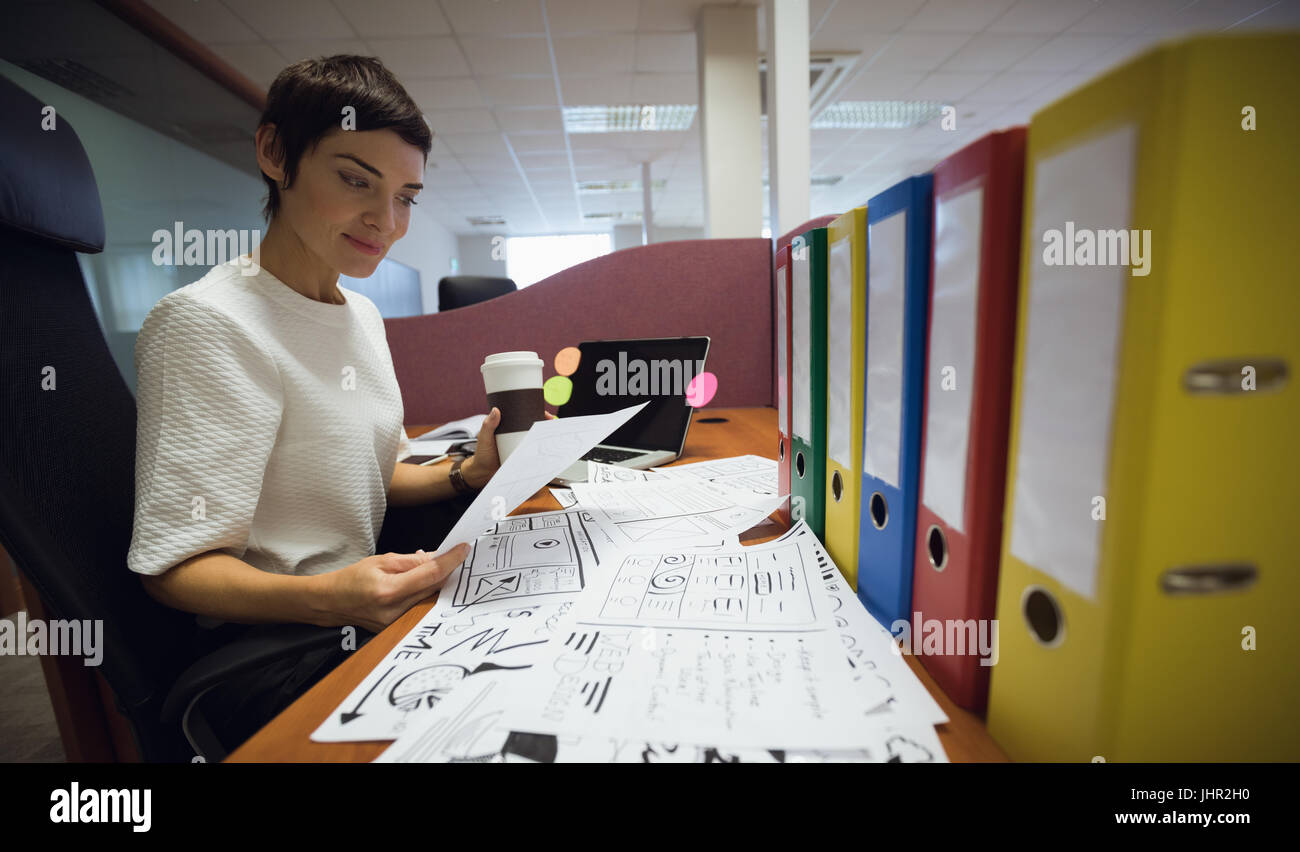 Working at office desk hi-res stock photography and images - Alamy