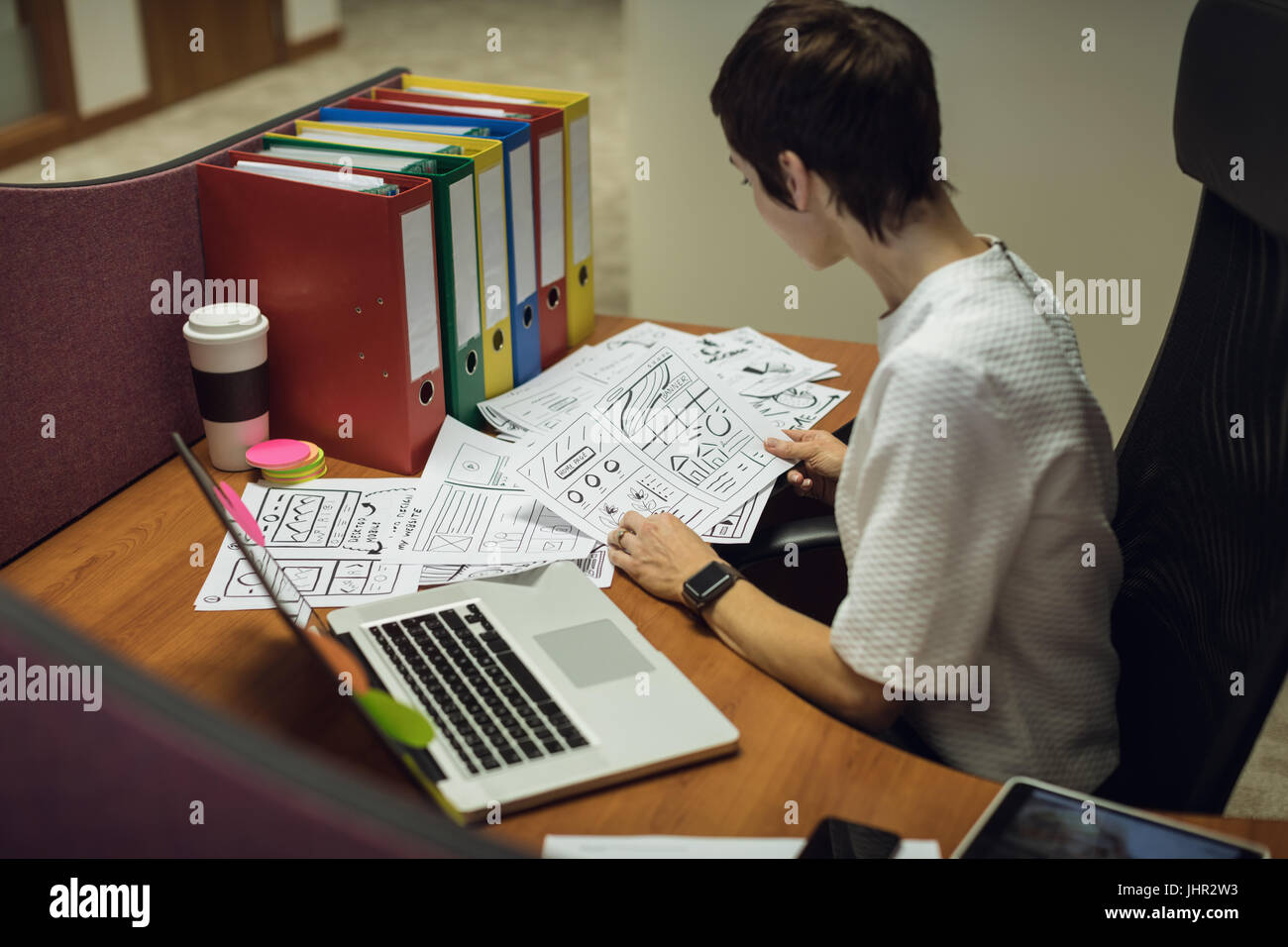 Businesswoman working at her desk in office Stock Photo - Alamy