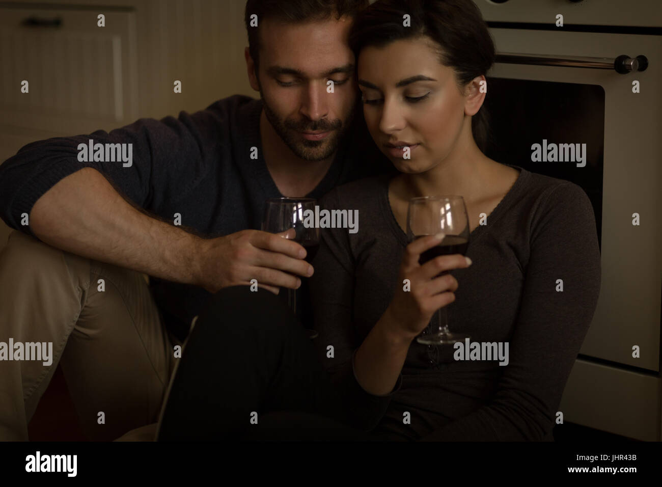 Sitting home couple in hi-res stock photography and images - Alamy