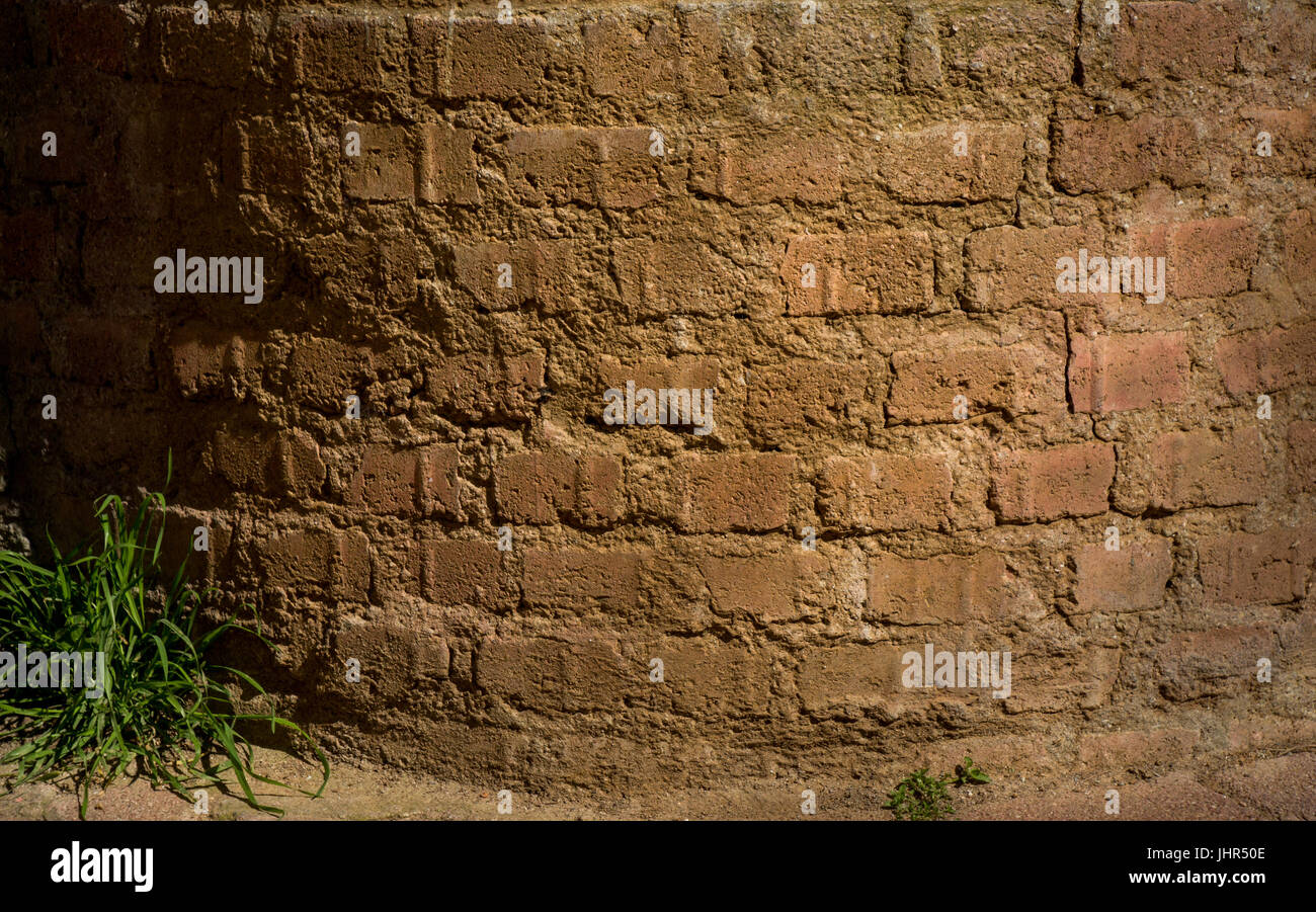 Old grunge brick wall as a background Stock Photo - Alamy