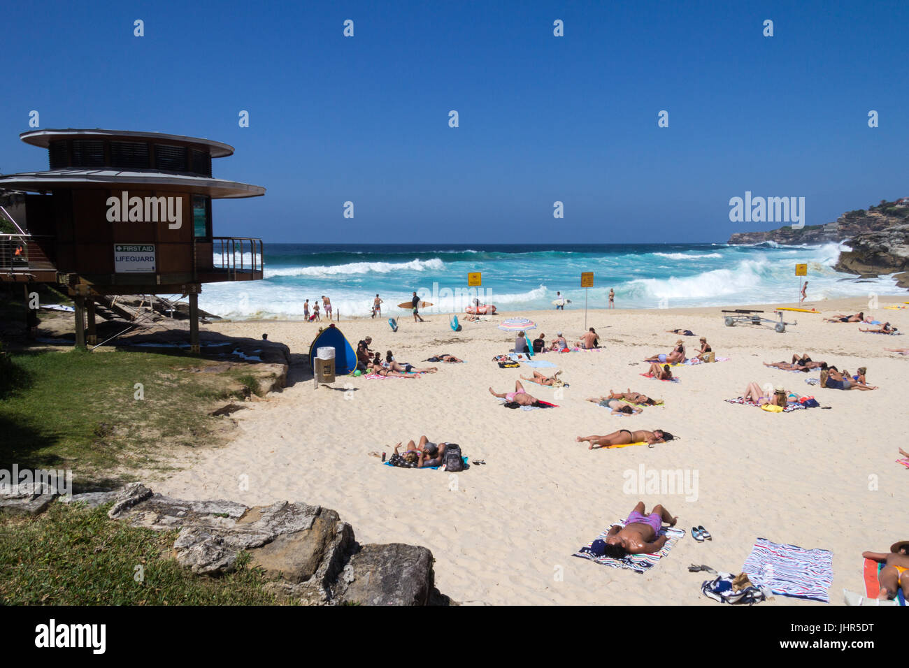 People enjoying the sunshine on Tamarama Beach, Sydney, New South Wales, Australia Stock Photo