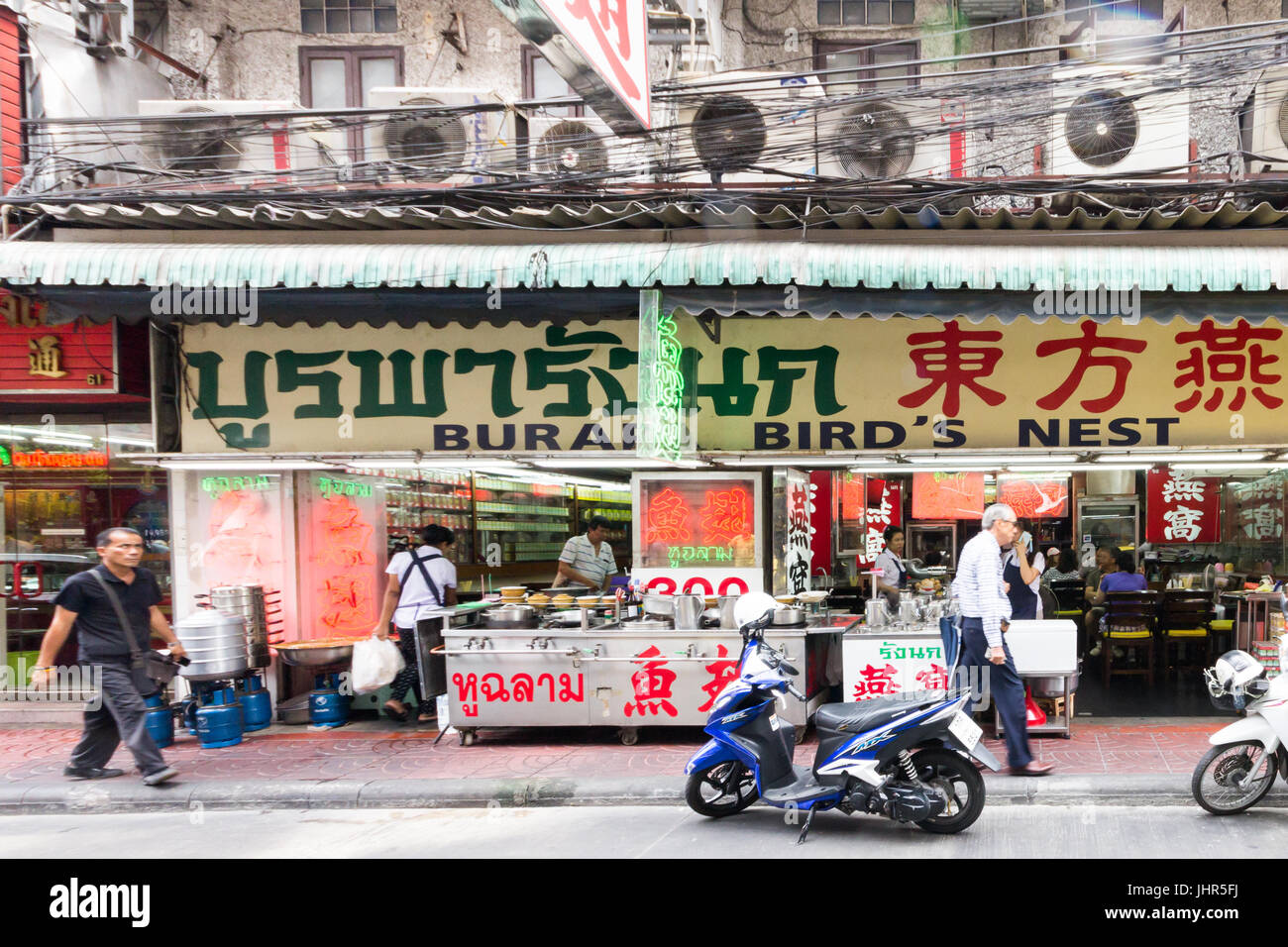 People walking past a Chinese birds nest restaurant in Chinatown, Bangkok, Thailand Stock Photo