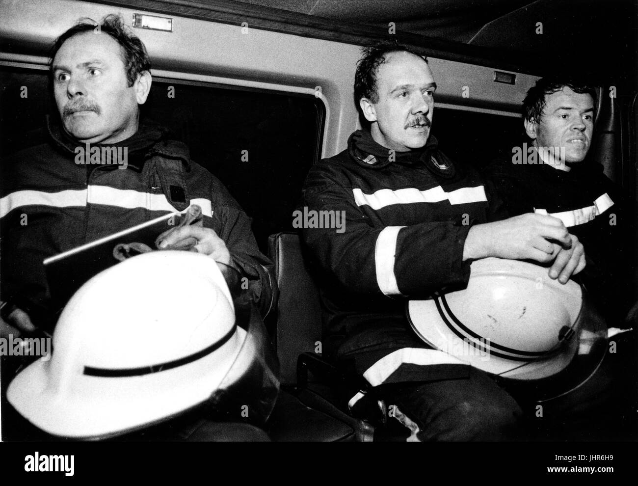 Fire fighters from West Midlands Fire Brigade get ready to go bake to their fire station after a fire has been put out in Wolverhampton Stock Photo