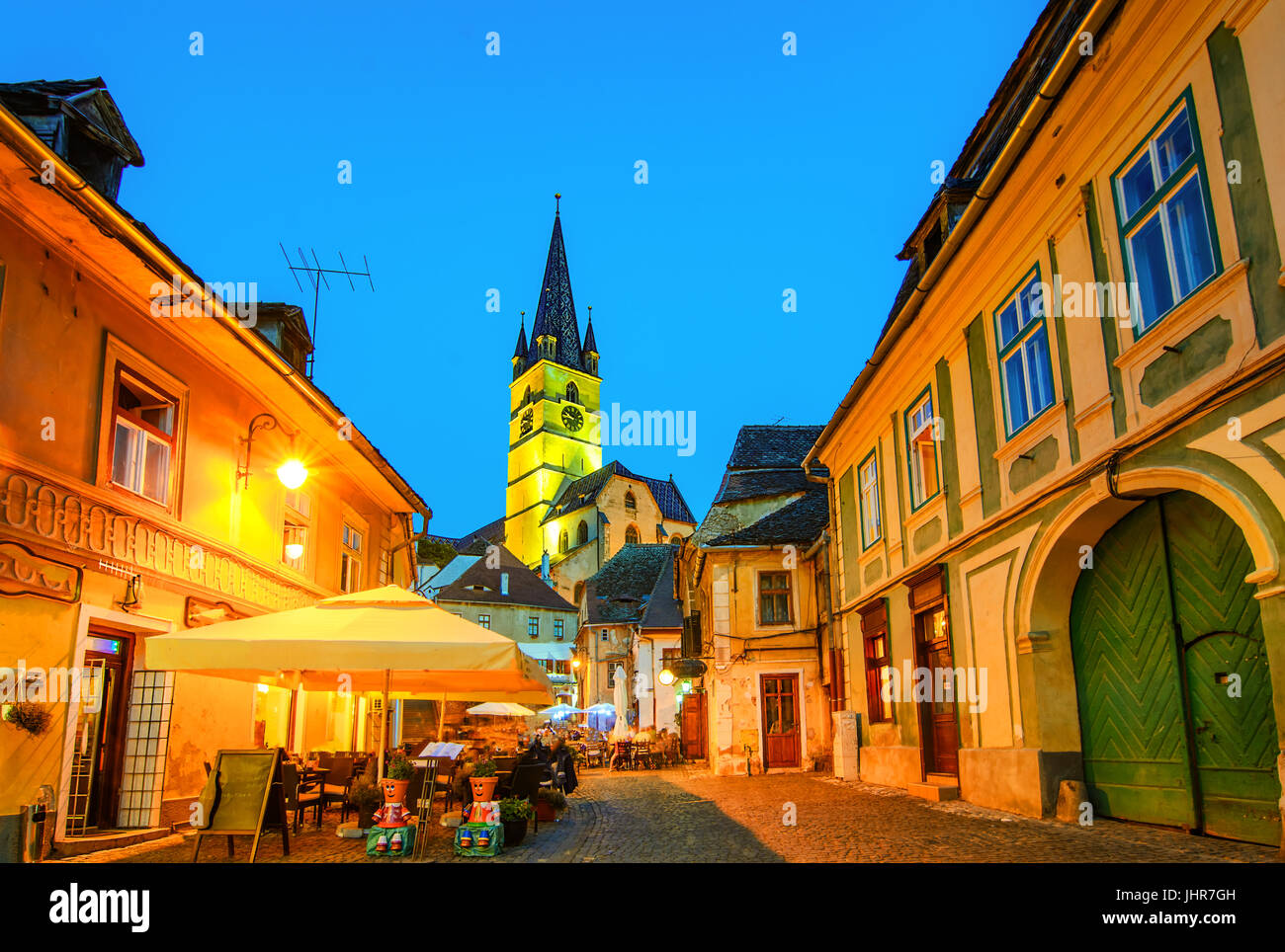 Lutheran Church, built  in the Huet Square,  seen from the streets of medieval Lower Town city, Transylvania,Sibiu, Romania. Stock Photo