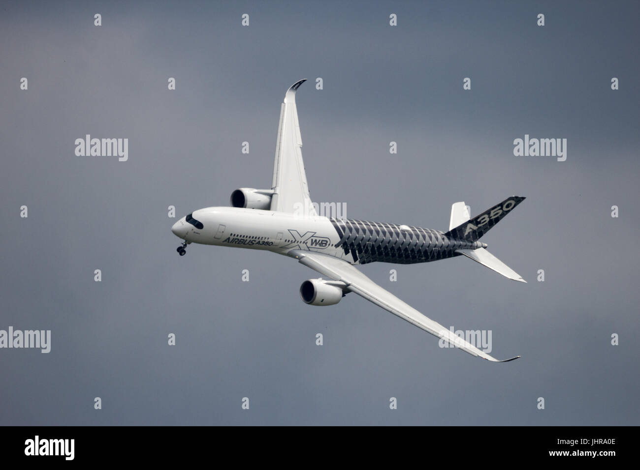 BERLIN - JUN 2, 2016: The new Airbus A350 XWB airliner flyby at Berlin-Schoneveld airport. Stock Photo