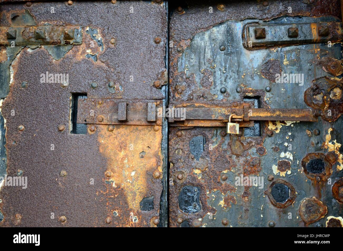 rusty rusting iron door old door of St Catherines Fort Tenby a 19th century Palmerston Fort Pembrokesire Wales Cymru UK GB Stock Photo