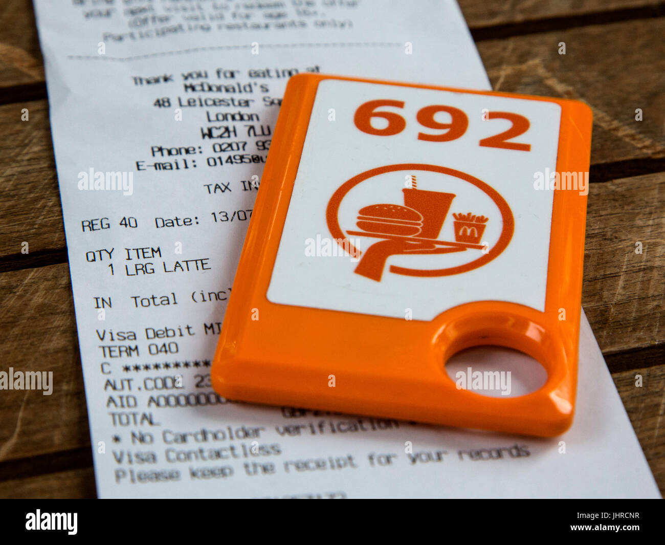 Geotag or GPS locators for the use in table service at McDonald's Leicester  Square restaurant, London, UK Stock Photo - Alamy