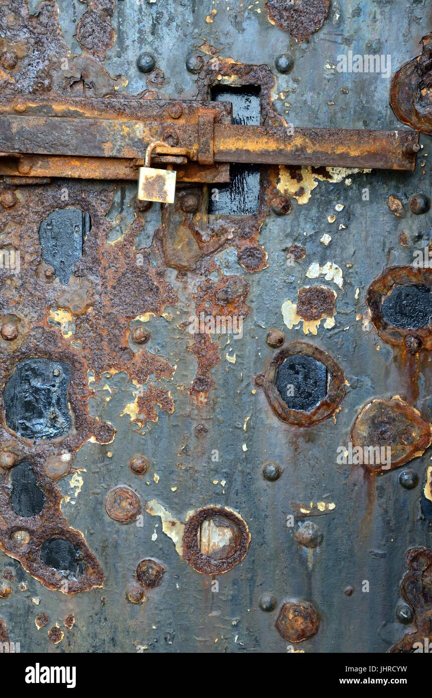 rusty rusting iron door old door of St Catherines Fort Tenby a 19th century Palmerston Fort Pembrokesire Wales Cymru UK GB Stock Photo