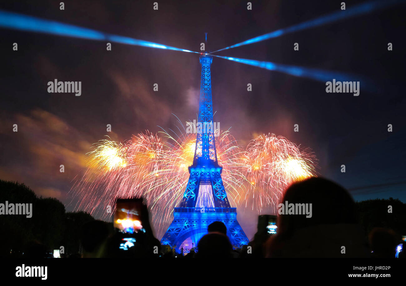 Famous Eiffel Tower and beautiful fireworks during celebrations of French national holiday - Bastille Day. Stock Photo