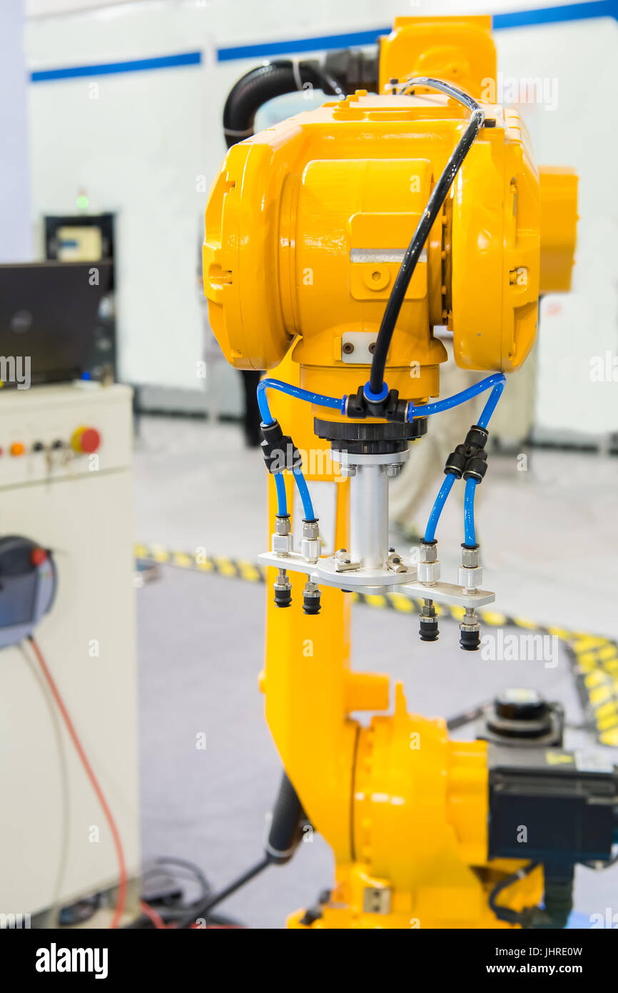 Industrial robot with vacuum suckers with conveyor in manufacture factory,Smart factory industry 4.0 concept. Stock Photo