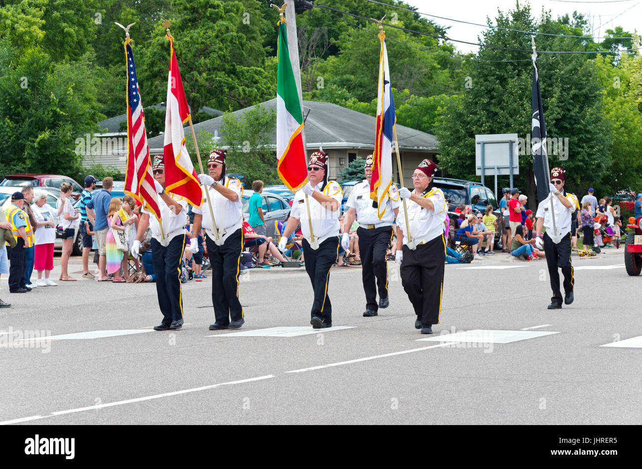 shriners bearing flags marches in annual mendota days parade through
