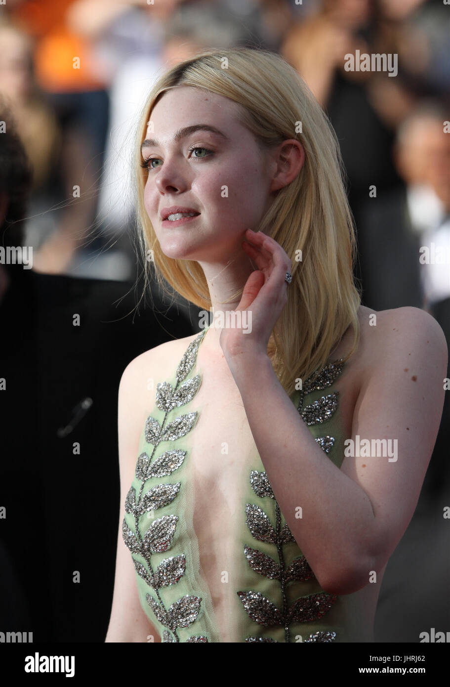 Actress Elle Fanning departs after the How To Talk To Girls At Parties screening during the 70th annual Cannes Film Festival at Palais des Festivals on May 21, 2017 in Cannes, France. Stock Photo