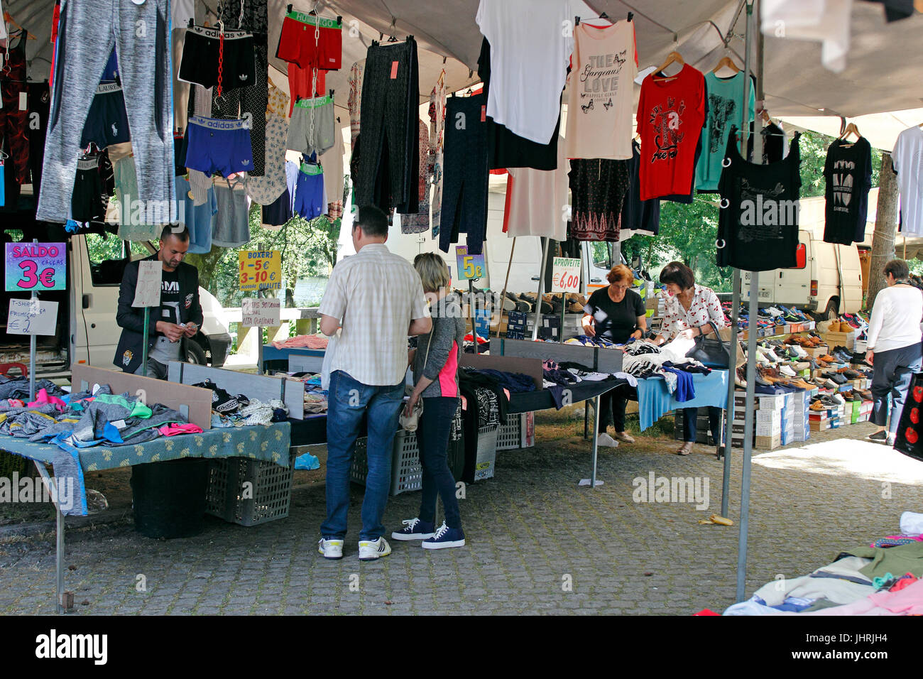 garments for sale at the Wednesday market Barca Portugal Stock Photo